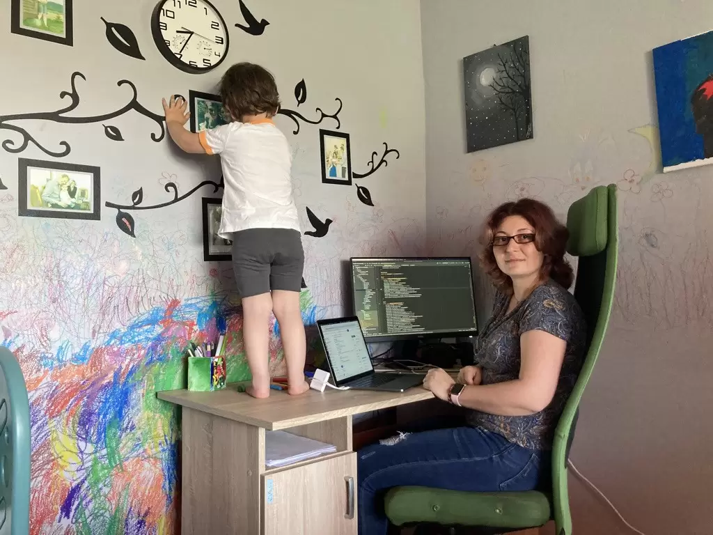Csenge and her son Marek working from home.